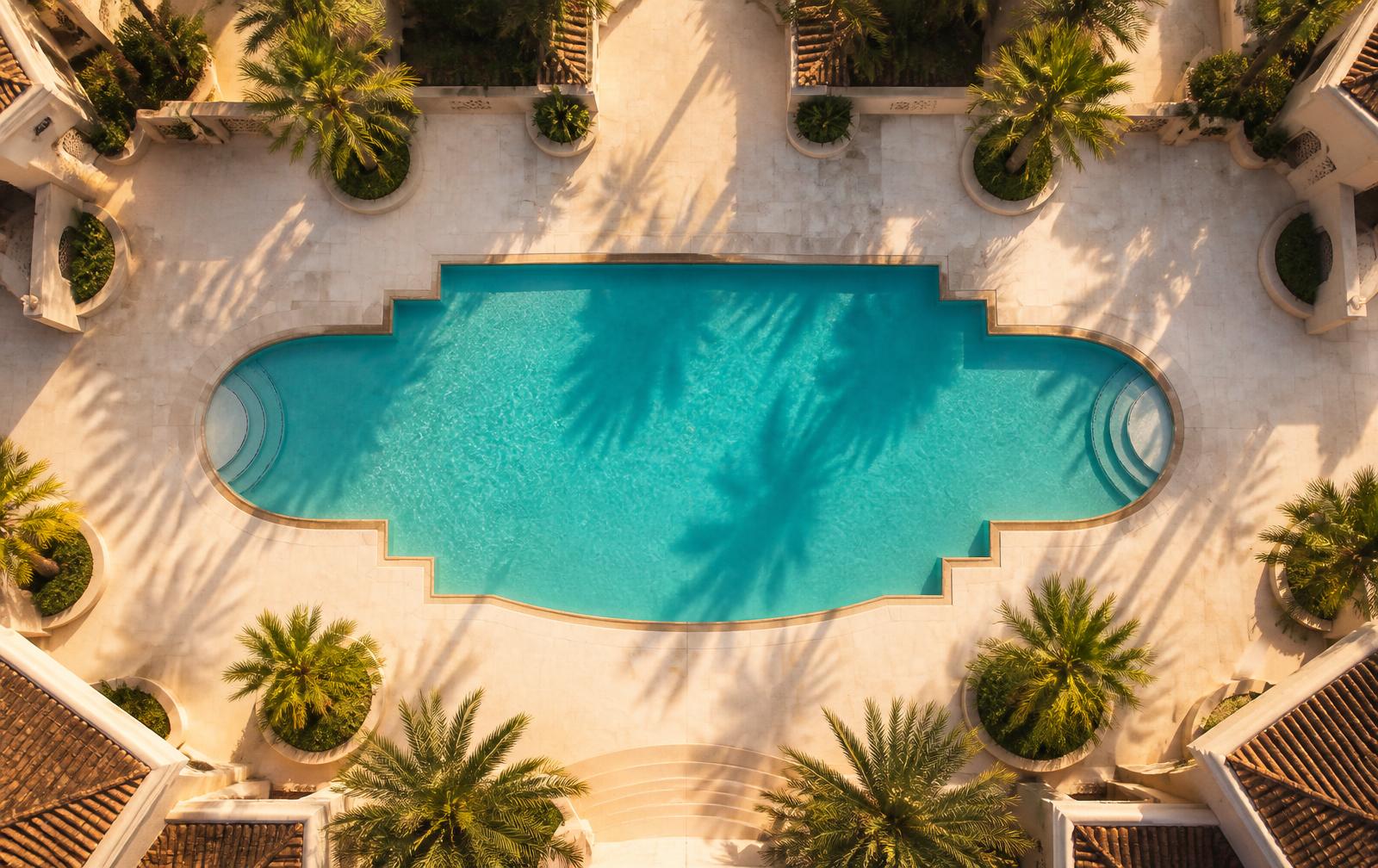 Drone view of a sample pool deck with a pin on every lounger